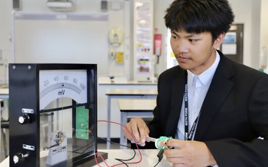 This is a pupil working on a physics experiment