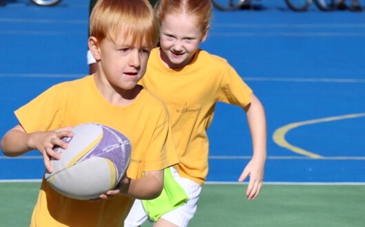 This is an image of 2 pupils in a P.E lesson