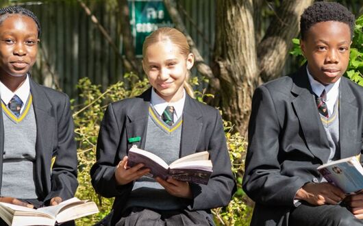Students reading outside