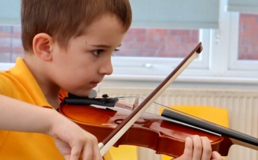 St Anthony's Catholic Primary School student playing violin
